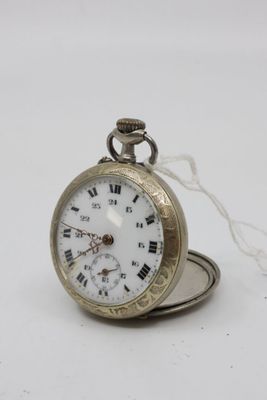 a silver pocket watch with roman numerals on it