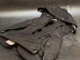 an image of a pair of jackets laying on a metal surface
