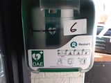 a parking meter on the side of a building
