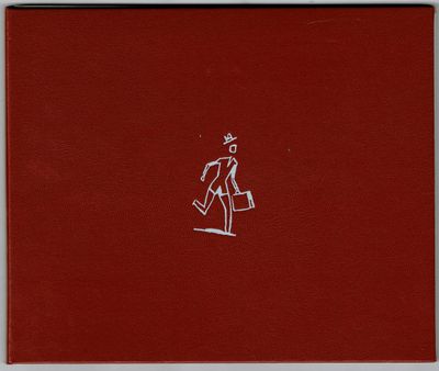 un livre rouge sur lequel est dessiné un homme en costume