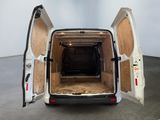 a white van with its doors open in a room