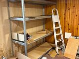 a room that has a ladder and boxes on the floor