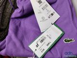 two tags on a pair of purple sweatshirts are attached to a pair of purple sweatshirts