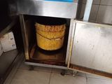 an image of a kitchen with a bucket in the middle of the floor