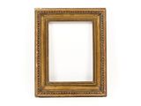 a gold picture frame on a white wall with a white background