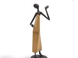 a statue of a woman in a dress is standing on a pedestal