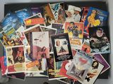 many different movie posters on the table together