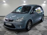 a picture of a small blue car parked in a garage