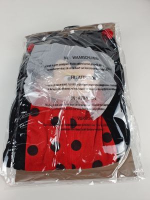 the ladybug socks are wrapped in plastic and ready to be worn