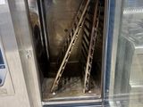 a small oven that is sitting on a pallet