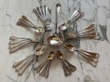 a lot of silver spoons and spoon spoons arranged in a circle