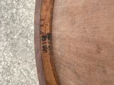 an up close view of a wooden chair with a wooden seat