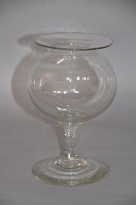 a glass vase that is sitting on a table
