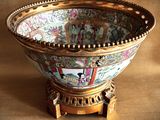 a bowl that is sitting on a stand on a table
