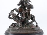 statue of a man riding a horse with a bunch of people on it