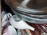 a box full of dishes and a bowl in it