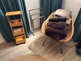an image of a bedroom with a bed and a chair
