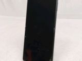 an image of a cell phone on a stand on a white surface