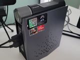 a video camera sitting on top of a desk next to a keyboard