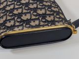 a black and gold purse on a white table