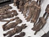 many wooden figurines that are on a table