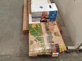 a pile of boxes sitting on the floor next to a wall