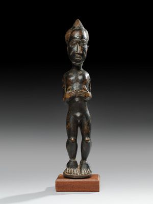 a bronze statue of a man with a helmet on his head
