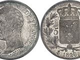 a close up of a coin with a crown on top of it