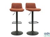 pair of orange upholstered bar stools with metal base