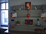 a glass shelf with a chalk board on it in a room