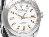 a close up of a watch with a white dial and orange hands