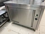 a stainless steel cabinet in a commercial kitchen