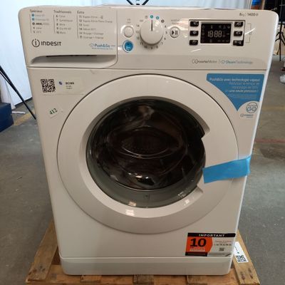 a washing machine that is sitting on a pallet