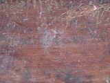 a close up of a piece of wood with a drawing on it