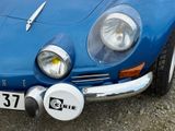 a close up of a blue car with a number plate on it