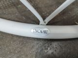 a close up of a bicycle wheel with a sticker on it
