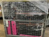 a cage with a bunch of luggage in it