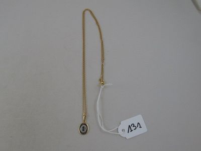 an image of a gold necklace with a black stone on it