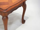 a small wooden table with a wooden top on a white background