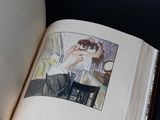 an open book with a picture of a woman in a bathrobe