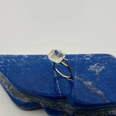 a close up of a blue stone with a ring on top of it