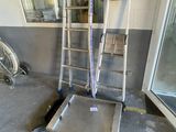 a ladder that is sitting in the middle of a room