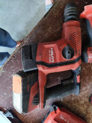 two electric tools that are sitting on a table