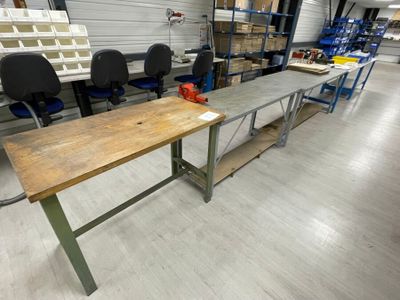 a long table in the middle of a room with several chairs