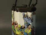 a small bag with a handle that has a picture of people on it