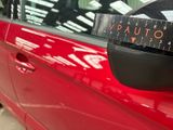a close up of a car with a sticker on it ' s side mirror