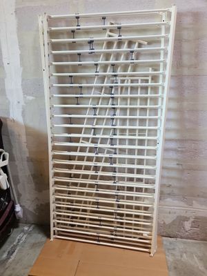 a picture of a rack with a bunch of shoes on it