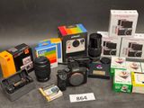 many different cameras and cameras that are sitting on a table