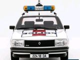 a white police car with blue lights on top of it
