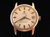an image of a gold watch with roman numerals